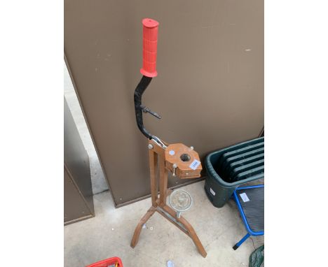 A VINTAGE BOTTLE CORKING TOOL