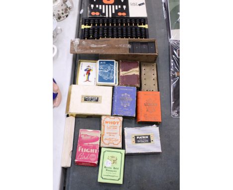 A QUANTITY OF VINTAGE GAMES AND PLAYING CARDS TO INCLUDE A VINTAGE WOODEN ABACUS, MAGNET BUILDING SET, DOMINOES, ETC.,