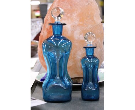 TWO HOLMEGAARD KLUK-KLUK DECANTERS IN KINGFISHER BLUE WITH CLEAR STOPPERS, HEIGHTS 22CM AND 16CM