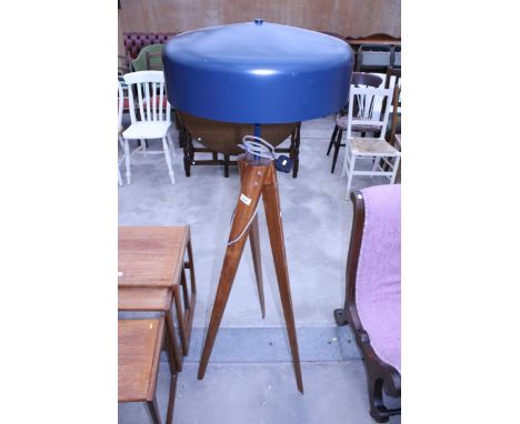 A HARDWOOD FLOOR LAMP WITH METALWARE SHADE