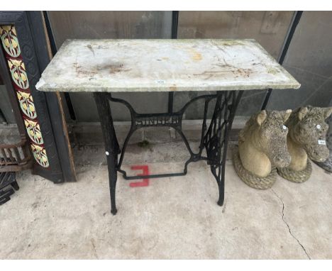 A CONSOLE TABLE FORMED WITH A SINGER TREADLE BASE AND A MARBLE TOP