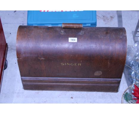 A VINTAGE SINGER SEWING MACHINE WITH WOODEN CARRY CASE