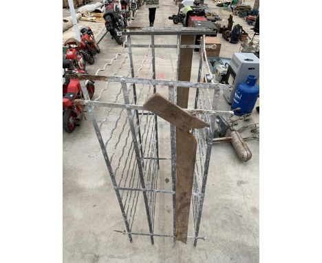 A LARGE VINTAGE METAL DOUBLE SIDED 192 BOTTLE WINE RACK