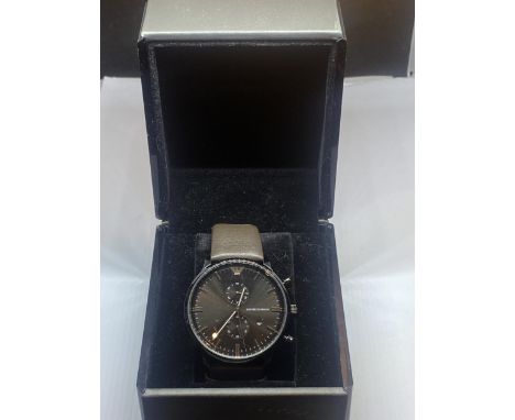 A BOXED EMPORIO ARMANI WRIST WATCH WITH TWO SUB DIALS AND DATE SEEN WORKING BUT NO WARRANTY