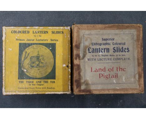 TWO BOXES OF MAGIC LANTERN SLIDES - 'THE TIGER AND THE TUB' AND 'THE LAND OF THE PIGTAIL'