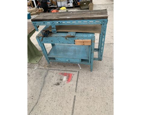A SMALL WOODEN WORK BENCH AND A SHELVING UNIT WITH A SMALL RECORD BENCH VICE