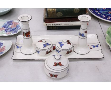 A VINTAGE CROWN DUCAL, BUTTERFLY THEMED DRESSING TABLE SET TO INCLUDE A TRAY, CANDLESTICKS AND THREE LIDDED TRINKET BOXES