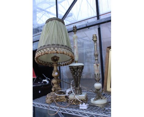TWO BRASS AND ONYX TABLE LAMPS AND A FURTHER GILT TABLE LAMP WITH SHADE