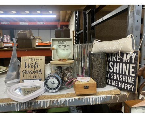 A MIXED LOT TO INCLUDE SIGNS, AN ALARM CLOCK, A TABLE LAMP, A METAL BOAT, STORAGE JARS ETC