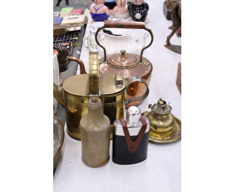 A BRASS KETTLE AND A COPPER KETTLE, BRASS BASE FOR AN OIL LAMP, VINTAGE STONE BOTTLE AND A LEATHER CASED HIP FLASK
