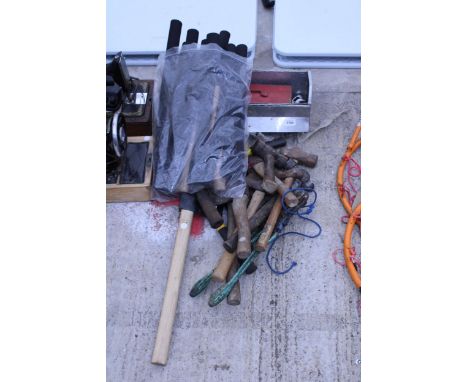 A LARGE ASSORTMENT OF TOOLS TO INCLUDE HAMMERS, AXES AND HANDLES ETC