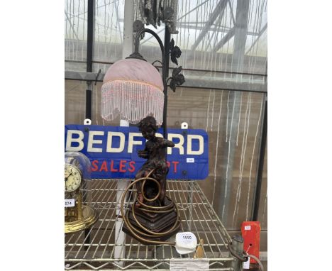 A RETRO TABLE LAMP WITH A FIGURE OF A YOUNG CHILD AND A DOG