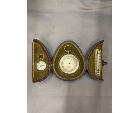 A VINTAGE POCKET CASED SET CONTAINING A BAROMETER, COMPASS AND THERMOMETER MARKED A &amp; N.C.S.LTD WESTMINSTER