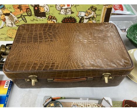 A LARGE CROCODILE SKIN BRIEFCASE