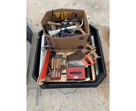 A LARGE ASSORTMENT OF TOOLS TO INCLUDE CHISELS, SAWS AND A BATTERY CHARGER ETC