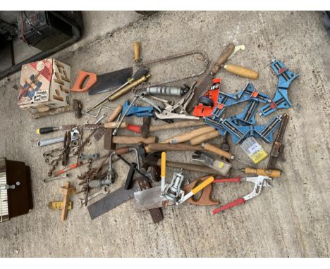 AN ASSORTMENT OF HAND TOOLS TO INCLUDE HAMMERS, SPANNERS AND SAWS ETC