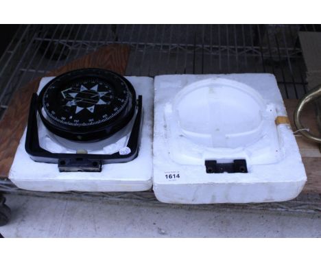 A DASH MOUNTED COMPASS