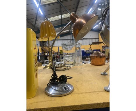A VINTAGE ADJUSTABLE DESK LAMP WITH A COPPER COLOURED ENAMEL SHADE
