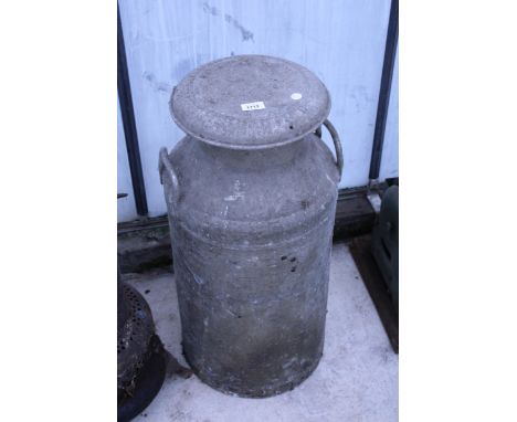 A VINTAGE ALUMINIUM MILK CHURN WITH LID