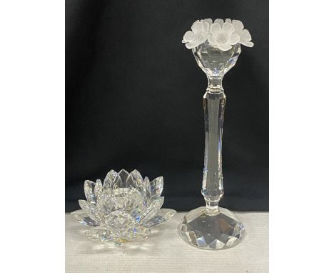 A SWAROVSKI CRYSTAL WATER LILY CANDLEHOLDER TOGETHER WITH A FLOWER TOPPED CANDLEHOLDER