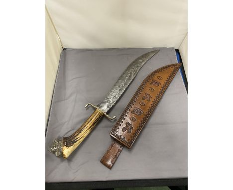 A LARGE HUNTING KNIFE AND LEATHER SCABBARD - 29 CM DAMASCUS BLADE - ANTLER GRIP HANDLE WITH BUFFALO POMMEL - LENGTH - 46 CM
