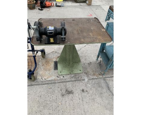 A METAL WORK BENCH WITH A MCKELLER BENCH GRINDER