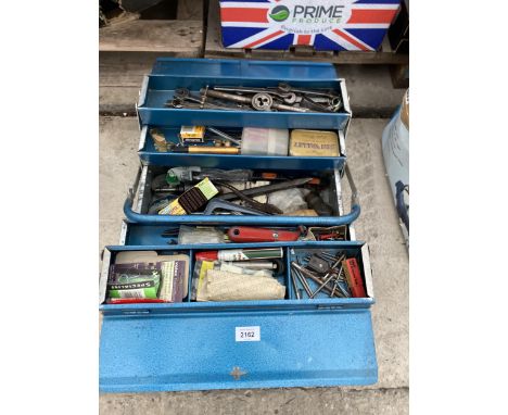 A METAL TOOL BOX WITH ASSORTED TOOLS TO INCLUDE SPANNERS, DIES AND PLIERS ETC