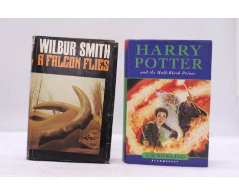 A 2005 FIRST EDITION HARRY POTTER AND THE HALF BLOOD PRINCE WITH DUST JACKET PLUS A FIRST EDITION WILBUR SMITH 'A FALCON FLIE