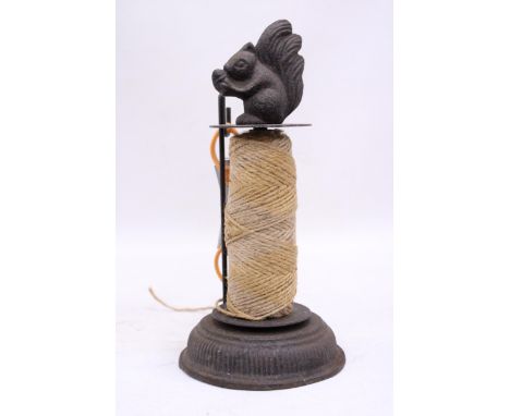 A VINTAGE STYLE CAST STRING HOLDER WITH A SQUIRREL TO THE TOP, HEIGHT 25CM