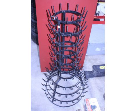 A VINTAGE METAL BOTTLE DRYING STAND