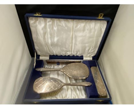 A BOXED HALLMARKED BIRMINGHAM SILVER FOUR PIECE SET TO INCLUDE HAIRBRUSH, MIRROR, COMB AND CLOTHES BRUSH