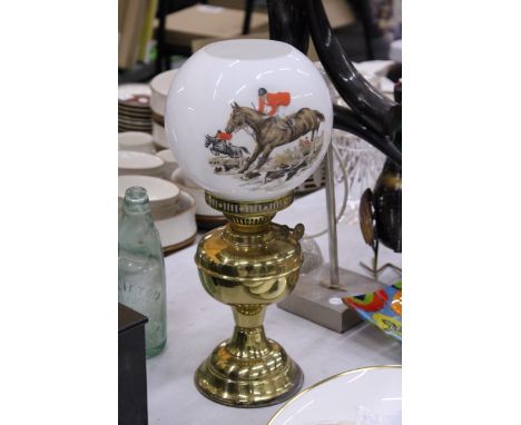 A VINTAGE OIL LAMP WITH GLASS SHADE WITH HUNTING SCENE TRANSFER