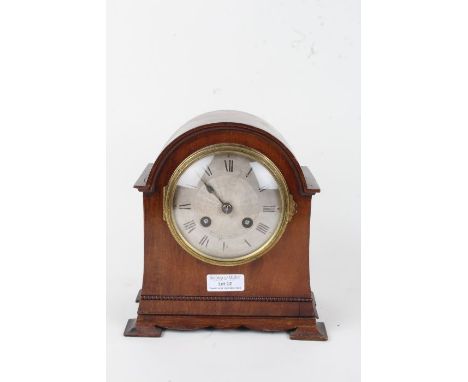 Early 20th Century mahogany mantel clock, the arched case having a silvered dial with Roman numerals, French twin train movem