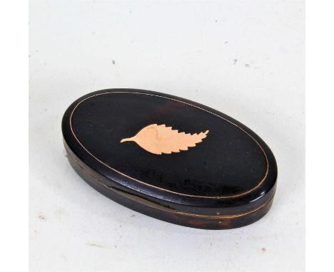 19th Century tortoiseshell snuff box, of oval form with gilt leaf to the lid, 8cm wide