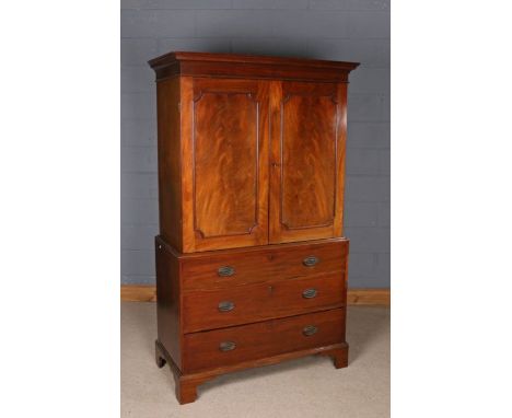 George III mahogany converted linen cupboard, the moulded cornice above a pair of panelled doors enclosing a brass hanging ra