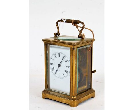 Early 20th Century brass cased carriage clock, the white dial with Roman numerals and outer minutes track, 8cm wide, 14.5cm h