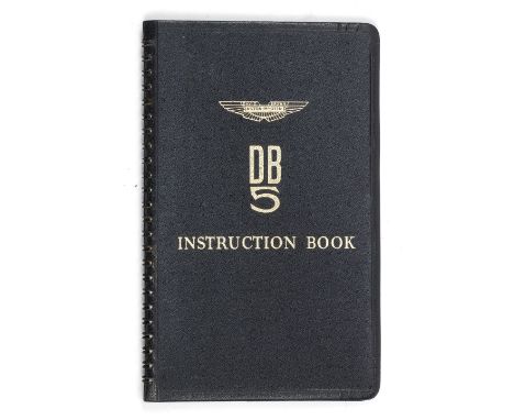 An Aston Martin DB5 Instruction Book,ring-bound black vinyl hard covers, of the type issued with the car, for the 4-Litre mod