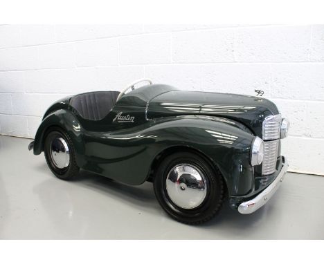 An Austin J40 pedal car,stamped chassis number overpainted when restored 30 years ago, finished in British Racing Green with 