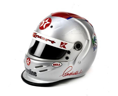 A signed Bell limited edition replica helmet for Mario Andretti,representing the full-face helmet worn in the 1994 Indy Car s