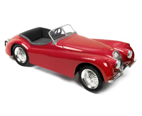 A Jaguar XK120 child's pedal car,marked 'NO J15' to underside of boot, steel chassis framework with treadle action to rear ax