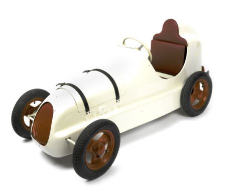 An Austin Pathfinder pedal car,stamped under the seat 3262, an older restoration, pressed steel body work painted ivory White