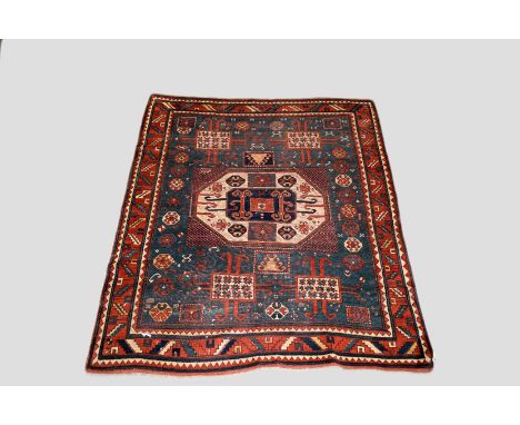 Karachov Kazak rug, south west Caucasus,late 19th century 6ft. 11in. X 5ft. 11in. 2.11m. X 1.80m. Hanging rings to left long 