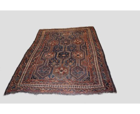 Khamseh carpet, Fars, south west Persia, circa 1930s, 9ft. 8in. x 7ft. 3in. 2.94m. x 2.21m. Overall wear; heavier in some pla