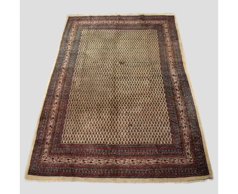 Saraband boteh carpet, north west Persia, mid-20th century, 10ft. 7in. x 7ft. 3.23m. x 2.13m. Small surface mark; 'bite' to l