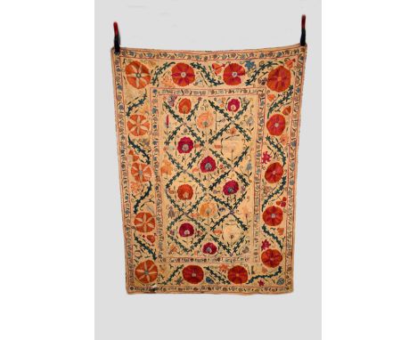 Small Uzbek suzani, Bokhara district, late 19th century, 62in. X 44in. 158cm. X 112cm. Cotton ground embroidered in coloured 