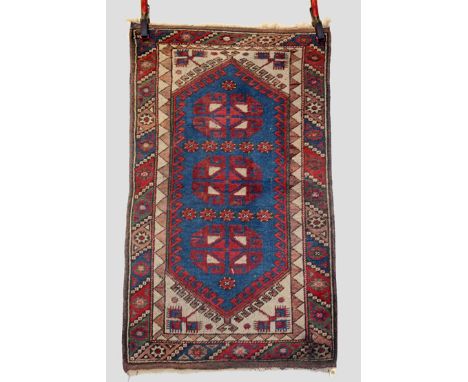 Two Anatolian rugs, mid-20th century, the first 4ft. 5in. X 3ft. 4in. 1.35m. X 1.02m. Two blue octagons with hooked medallion