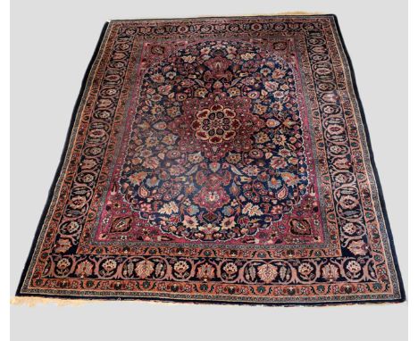 Mashad carpet, Khorasan, north east Persia, circa 1920s-30s, 11ft. 10in. x 9ft. 4in. 3.60m. x 2.85m. Some wear; splits to upp