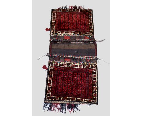 Two Baluchi double khorjin, Khorasan, north east Persia, circa 1930s-40s, the first, 5ft. 1in. X 2ft. 2in. 1.55m. X 0.66m. Re
