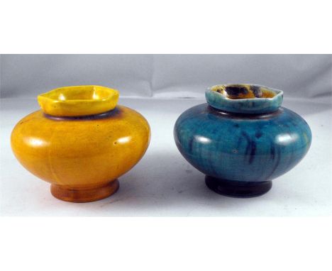 A pair of Linthorpe pottery squat vases, blue and yellow glaze, No. 2255 5.5cm high (2) 