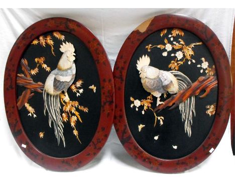 A pair of late 19thC/ early 20thC Japanese shibayama style wall plaques depicting cockerels sat on branches in mother of pear